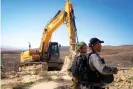  ?? Photograph: APAImages/REX/ Shuttersto­ck ?? Israeli forces raze four water wells in Masafer Yatta, south of Hebron, in February 2022.