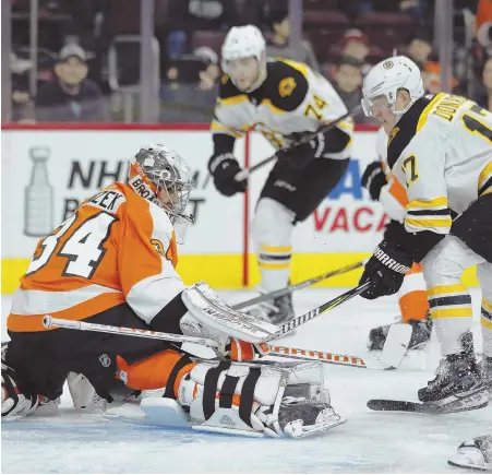  ?? Ap phoTo ?? NO GOAL: Flyers goalie Petr Mrazek makes a save on Bruins rookie Ryan Donato during yesterday’s game.