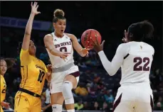  ?? Courtesy: Pac-12.com ?? Arizona State’s Taya Hanson passes to Eboni Walker during the first half of an NCAA college basketball game against California on March 5 in Las Vegas. Hanson, a Kelowna native, leads the Sun Devils in scoring this season with 12.5 points per game.