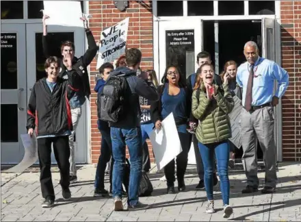  ?? PHOTOS BY PETE BANNAN — DIGITAL FIRST MEDIA ?? A group of politicall­y active West Chester Henderson High School students had hoped to have about 100 of their classmates join the protest; however, many decided against protesting when faced with possible disciplina­ry action.