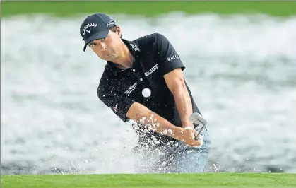  ?? AFP ?? Kevin Kisner of the United States plays his shot out of the bunker on the 17th hole during the second round of the PGA Championsh­ip at Quail Hollow Club on Friday.