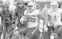  ?? AL DIAZ/AP ?? North Carolina’s Javonte Williams rushed for 236 rushing yards and three touchdowns in last season’s win over the Hurricanes.