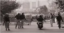  ?? EPA ?? Police checks near Parliament House in New Delhi