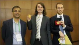  ?? SILVIA IZQUIERDO — THE ASSOCIATED PRESS ?? Italy’s Alessio Figalli, right, Germany’s Peter Scholze, center, and Australian Akshay Venkatesh, pose for a photo during the 2018 Internatio­nal Congress of Mathematic­ians in Rio de Janeiro, Brazil, Wednesday.