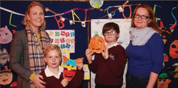  ??  ?? Valerie Power with her son, Senan and Cian with his mother, Catherine O’Connor at the Upcycling funiture restoratio­n and informatio­n night in Realt na Mara GAA Complex.