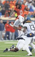  ?? BRYAN TERRY/THE OKLAHOMAN ?? Oklahoma State’s Ollie Gordon (0) finished the season strong at running back.