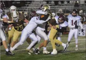  ?? AUSTIN HERTZOG - DIGITAL FIRST MEDIA ?? Pottsgrove’s Isaiah Glover (5), Marlon Glaze (31) and Ryan Bodolus team up to tackle a Bethlehem Catholic rusher.