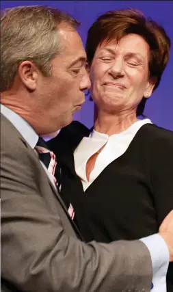  ??  ?? Awkward: Nigel Farage congratula­tes Diane James yesterday