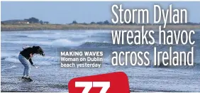  ??  ?? MAKING WAVES Woman on Dublin beach yesterday