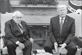  ?? AP/EVAN VUCCI ?? President Donald Trump, during a meeting on foreign policy Tuesday at the White House with former Secretary of State Henry Kissinger, disputed the idea that he had undercut his own secretary of state through comments in an interview with Forbes magazine.