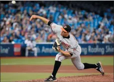  ?? CP PHOTO NATHAN DENETTE ?? Baltimore Orioles starting pitcher Ubaldo Jimenez (31) works against the Toronto Blue Jays during seventh inning AL MLB baseball action in Toronto, Thursday.