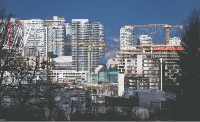  ?? DARRYL DYCK/THE CANADIAN PRESS ?? Recent data disclosed by City of Vancouver staff show that there has been more new dwellings produced than household growth since 2001, Elizabeth Murphy observes, which makes the city’s rush to rezone seem strange.