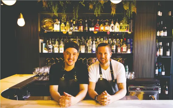  ??  ?? Blake Flann, left, with his partner and front of house manager Kale Mcivor at 4296 in Canmore.