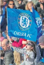  ?? ?? A young Chelsea fan flies the flag