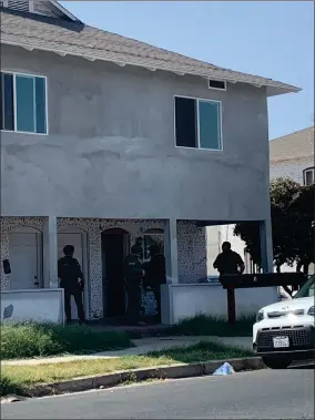  ?? RECORDER PHOTO BY ESTHER AVILA ?? Portervill­e Police Officers at a home during a situation that happened near downtown Portervill­e on Thursday, August 26.