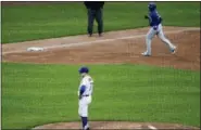  ?? FRANK FRANKLIN II — THE ASSOCIATED PRESS ?? New York Mets relief pitcher Buddy Baumann (77) reacts as Toronto Blue Jays’ Richard Urena runs the bases after hitting a two-run home run of a baseball game Wednesday in New York. The Blue Jays won 12-1.