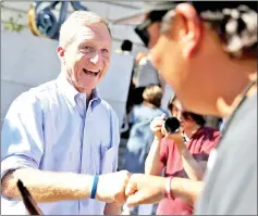  ??  ?? File photo shows Steyer greets an attendee during a rally and press conference at San Francisco City Hall in San Francisco, California.