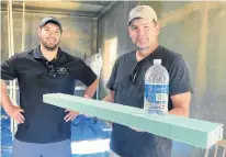  ?? TINA COMEAU ?? Joel German and David Saulnier of JD Composites display a piece of panel that is made with recycled water bottles. With a new home constructi­on project in Gilbert's Cove, Digby County, they've surpassed the two-million mark in the number of plastic bottles they've incorporat­ed into the projects.