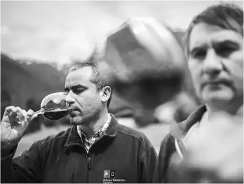  ??  ?? Enologist drinking wine. Chile’s central vineyards have for years been recognised as a source of decent wine. The country as a whole is the world’s eighth biggest producer.