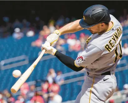  ?? ALEX BRANDON/AP ?? Pittsburgh’s Bryan Reynolds connects for a three-run homer in the seventh inning against the Washington Nationals on Wednesday. Reynolds finished with three homers in the game.