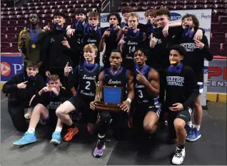  ?? BILL UHRICH — READING EAGLE ?? Exeter poses with the trophy after defeating Manheim Central in a District 3Class 5A title game Thursday.