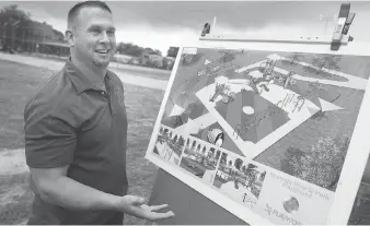  ?? DAX MELMER ?? Mark Jones, regional manager at New World Park Solutions Inc., explains the design of the Farrow Riverside Miracle Park playground during a community fundraiser at Riverside Park on Saturday.