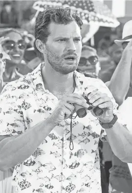  ??  ?? In “Barb & Star Go to Vista Del Mar,” Jamie Dornan wears a lot of Hawaiian shirts. “I loved everything I put on,” he says.