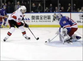  ?? FRANK FRANKLIN II — ASSOCIATED PRESS ?? Rangers’ Henrik Lundqvist stops a shot by Senators’ Mark Stone during Game 6 of Stanley Cup playoffs.