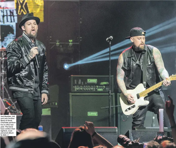  ?? AP ?? Joel Madden, left, and twin brother Benji of Good Charlotte perform live in Ohio last year. The band have written their tightest, most personal album to date