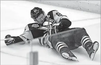  ?? [GENE J. PUSKAR/THE ASSOCIATED PRESS] ?? Pittsburgh’s Sidney Crosby lies on the ice after taking a hit from Washington’s Matt Niskanen during the first period of Game 3 on Monday in Pittsburgh. RANGERS 4, SENATORS 1: