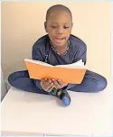  ?? ?? Making a difference Cultural developmen­t officer Heather Paton and one of the children reading a letter from their new friend