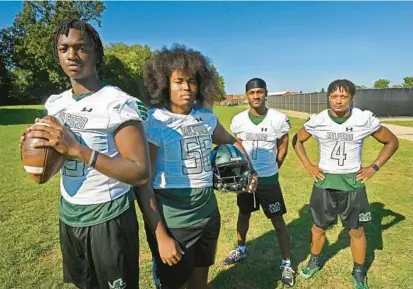 ?? KENNETH K. LAM/BALTIMORE SUN ?? Milford Mill quarterbac­k Deshawn Purdie, from left, offensive tackle Rashard Herring, wide receiver Daysen Shell and running back Sean Williams Jr. are part of the offense that has delivered staggering production and led the way in a 3-0 start, with the Millers outscoring three opponents by a 132-23 margin while piling up 1,159 total yards.