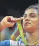  ?? REUTERS ?? PV Sindhu with her Olympics silver medal for women’s singles (badminton)