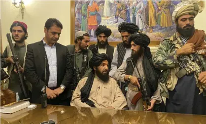  ??  ?? Taliban fighters take control of the presidenti­al palace in Kabul after the Afghan president Ashraf Ghani had fled the country. Photograph: Zabi Karimi/AP