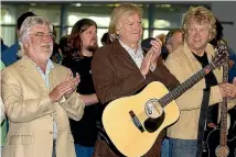  ?? MAARTEN HOLL/STUFF ?? The Moody Blues - Graeme Edge, Justin Hayward and John Lodge - arrive at Wellington airport in 2006.