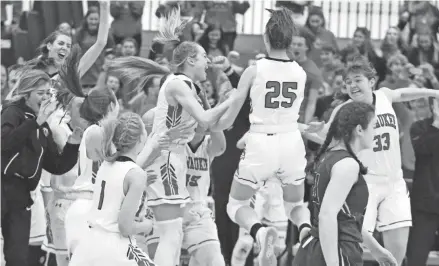  ?? CURT HOGG / NOW NEWS GROUP ?? Pewaukee players celebrate after the buzzer sounds on their sectional final win over Pius XI on Saturday at Cudahy High School.