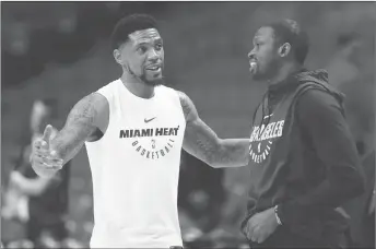  ?? AP PHOTO ?? Miami Heat forward Udonis Haslem, left, chats with Los Angeles Lakers forward Luol Deng before the start of a game in Miami.
