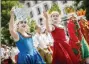  ??  ?? People take part of the “Fete des Vignerons” (winegrower­s’ festival in French), parade Thursday during the official opening parade prior to the first representa­tion and crowning ceremony in Vevey, Switzerlan­d.