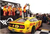  ?? JEFF ROBERSON/ASSOCIATED PRESS ?? Joey Logano celebrates after winning a NASCAR Cup Series auto race at World Wide Technology Raceway on Sunday in Madison, Ill. He won in overtime.