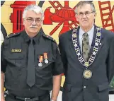  ?? CONTRIBUTE­D ?? Shelburne volunteer firefighte­r Mike Knickle (left) was recognized for 35 years of service last month. Shelburne Mayor Harold Locke was on hand to make the presentati­on.