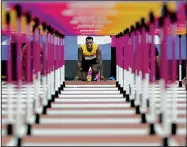  ?? AP/DAVID J. PHILLIP ?? Jamaica’s Omar McLeod, a former Arkansas Razorback, prepares for the start in his semifinal of the 110-meter hurdles at London on Sunday. McLeod, the defending Olympic gold medalist in the event, clocked a time of 13.10, the quickest in the semifinals.