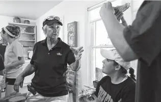  ?? Staff file photo ?? Former Trinity University women’s tennis coach and star Emilie Burrer Foster talks with players in 2014. In 1968, she and Becky Vest brought home a title without a coach — or even an official “team.”