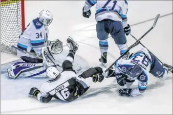  ?? GARY MANNING ?? Wildcats captain Makail Parker takes a tumble in front of the Edmundston net.