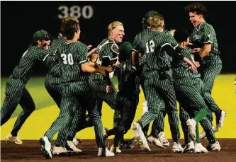  ?? Ronald Cortes/contributo­r ?? Reagan celebrates after Caden Roy walked it off with a bases-loaded fly ball in the ninth, capping a comeback from an early 4-0 deficit and handing Johnson its first district loss.