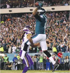  ?? MITCHELL LEFF/GETTY IMAGES ?? Alshon Jeffery of the Philadelph­ia Eagles catches a touchdown pass against the Minnesota Vikings Sunday.