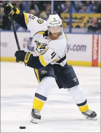  ?? AP PHOTO ?? Nashville Predators defenseman Ryan Ellis shoots and scores against the St. Louis Blues during Game 2 of an NHL second-round playoff series on April 28 in St. Louis.