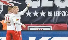  ??  ?? Leipzig’s forward Timo Werner (left) celebrates with Leipzig’s Swedish midfielder Emil Forsberg after scoring the second time during the German Bundesliga football match against Mainz 05 in Leipzig. — AFP photo