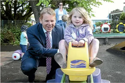  ?? KEVIN STENT/STUFF ?? Education Minister Chris Hipkins with Lucy Turner, 3, at the launch of the Government’s draft strategic plan for early learning.