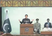  ?? RAHMAT GUL — THE ASSOCIATED PRESS ?? Pakistan Prime Minister Imran Khan speaks during the 17th extraordin­ary session of Organizati­on of Islamic Cooperatio­n Council of Foreign Ministers, in Islamabad on Sunday. Leaders are trying to avert a financial crisis.