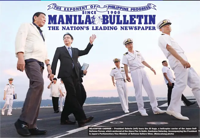  ?? (Malacañang photo) ?? HELICOPTER CARRIER – President Duterte (left) tours the JS Kaga, a helicopter carrier of the Japan SelfDefens­e Forces, which anchored at the Alava Pier in Subic, Zambales Saturday. Accompanyi­ng the President is Japan's Parliament­ary Vice Minister of Defense Keitaro Ohno.